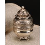 A William IV silver ovoid tea caddy, chased with fruiting vine, 13cm high, Robert Hennell, London