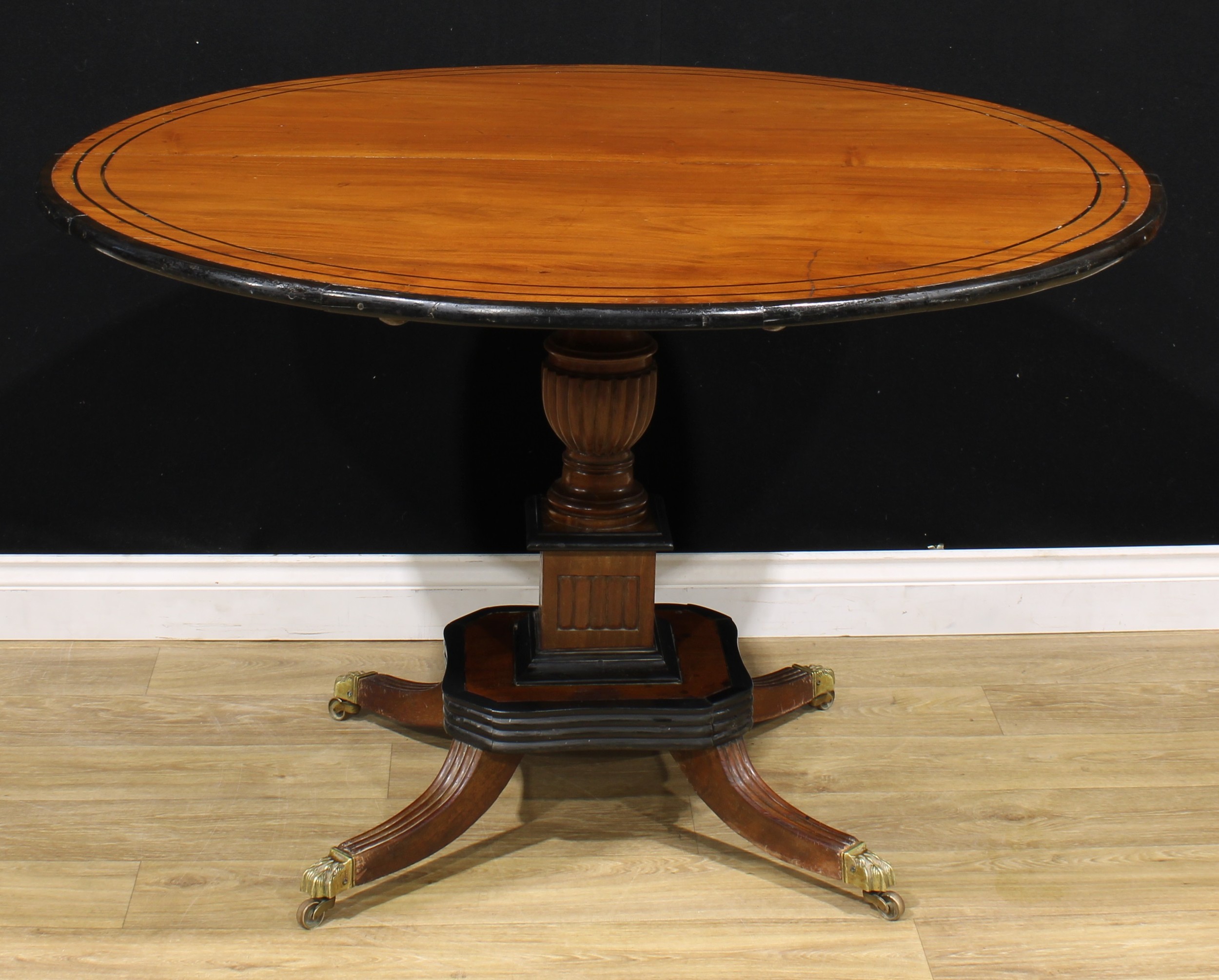 A 19th century Indo-Dutch jackfruit and ebonised centre table, circular tilting top turned and - Image 2 of 4