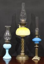 A late Victorian/Edwardian table oil lamp, Duplex burner, moulded graduated yellow glass font, brass