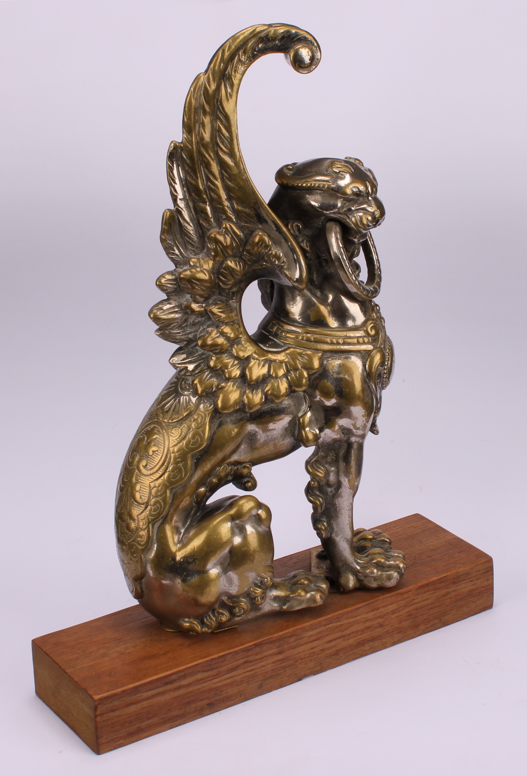 A 19th century parcel-silvered model, cast as a winged lion, 31cm high, hardwood plinth, 35cm high - Image 3 of 4