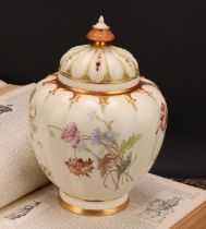 A Royal Worcester lobed ovoid pot pourri vase and cover, painted with flowers on an ivory ground,