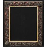 A Victorian rectangular gesso and wood picture frame, boldly applied with trailing oak leaves and