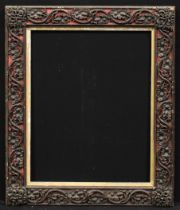 A Victorian rectangular gesso and wood picture frame, boldly applied with trailing oak leaves and