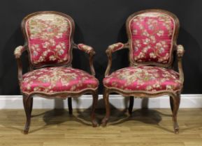 A pair of 19th century French Louis XV Revival beech fauteuil à la reine elbow chairs, 86cm high,