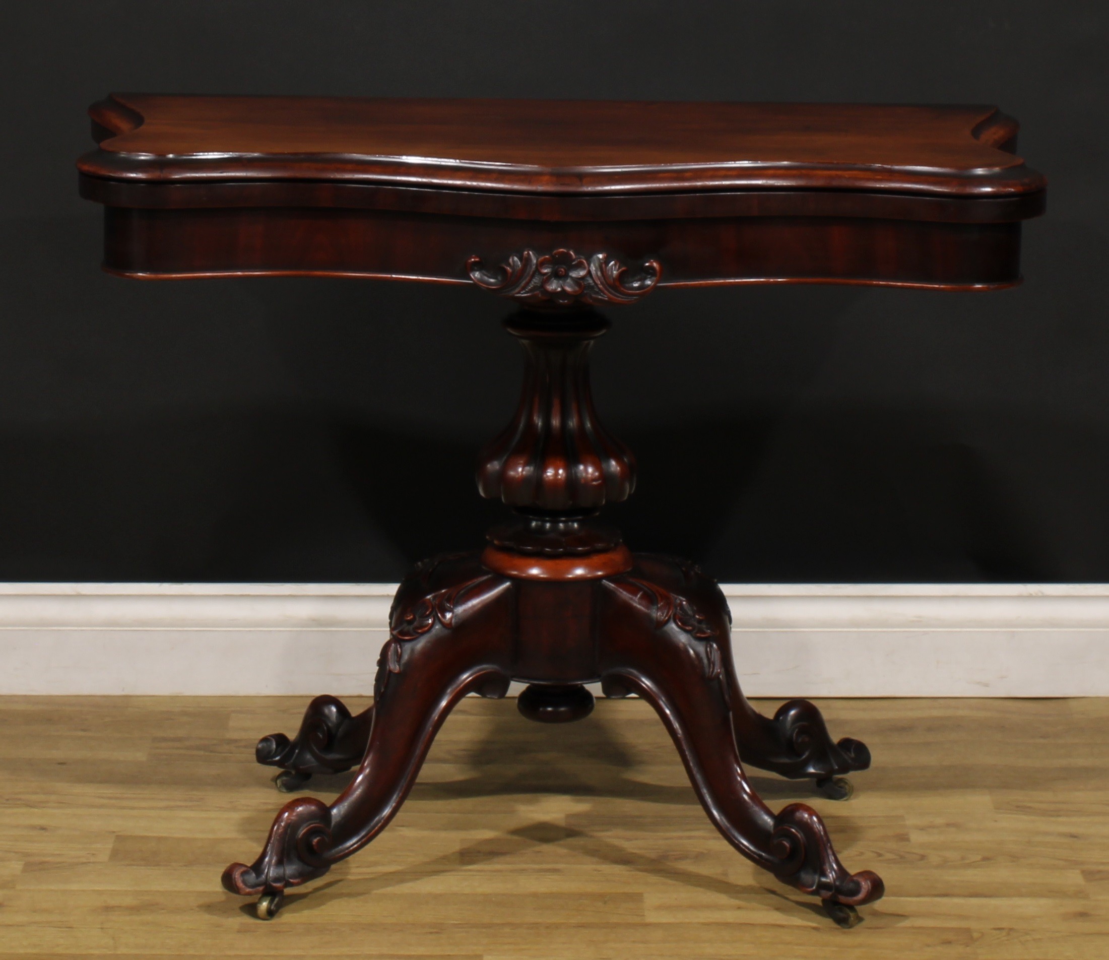 A Victorian mahogany serpentine card table, hinged top with moulded edge enclosing a baize lined - Image 2 of 6