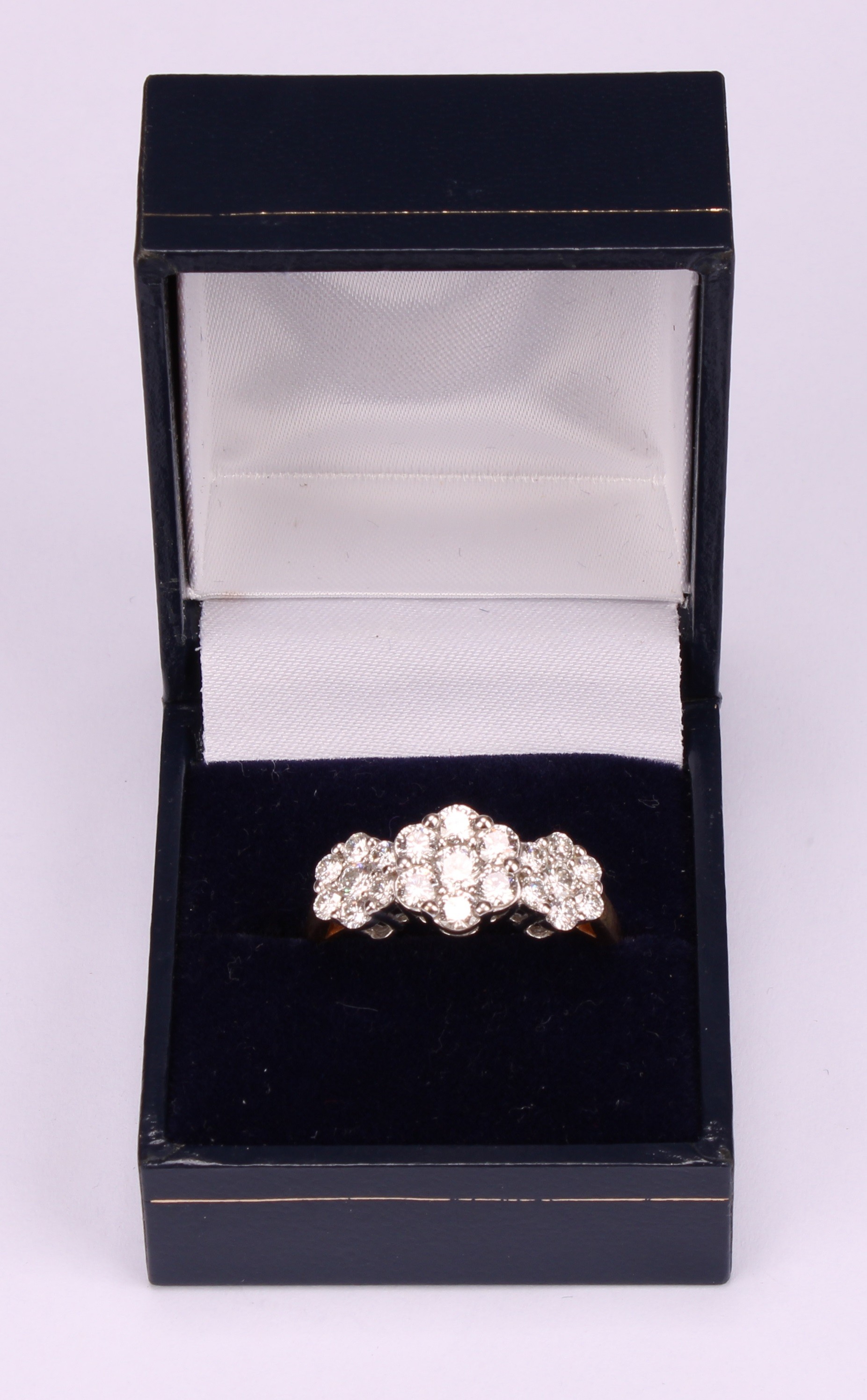 A diamond cluster ring, three graduated flowerhead cluster set with twenty one round brilliant cut - Image 5 of 5