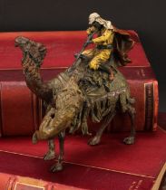 An Austrian cold painted bronze, in the manner of Bergman, of an Arab warrior on a camel, under