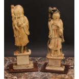 A pair of Chinese soapstone figures, carved as Shou Lao and Guanyin, each picked out in
