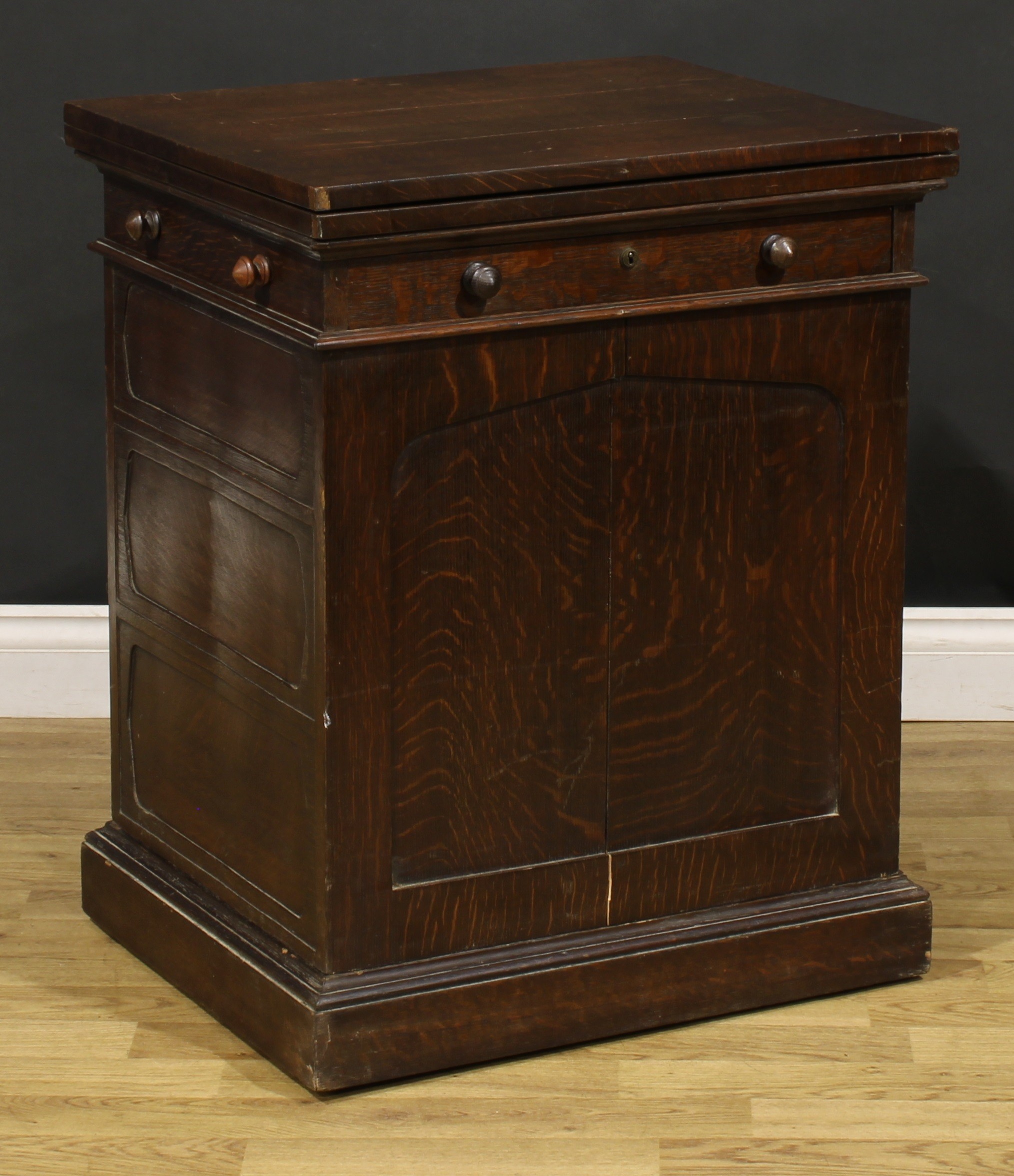 A late 19th century oak single pedestal desk, hinged top enclosing a baize surface above a long - Image 4 of 6