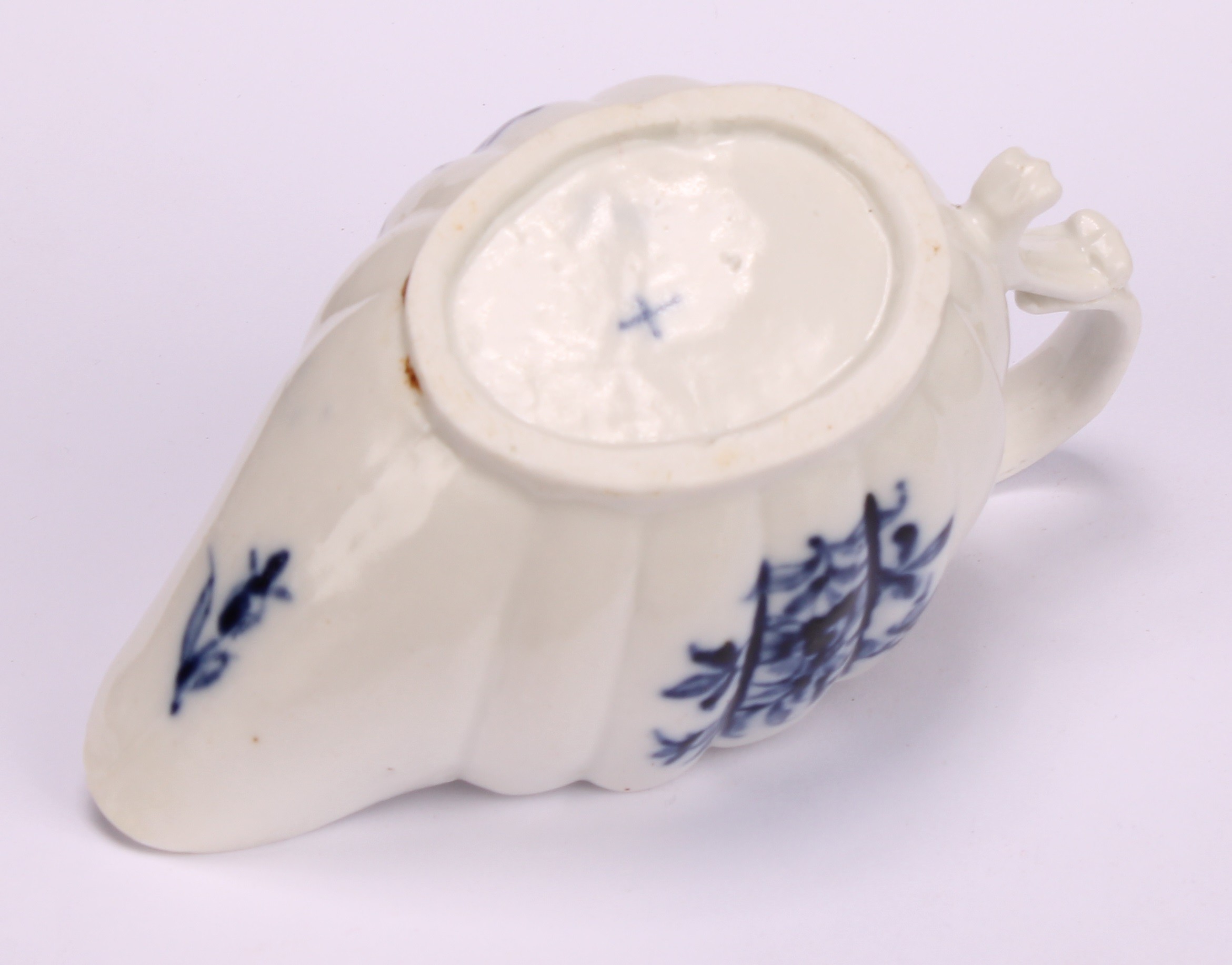 A Cookworthy Bristol butter boat, of fluted form, painted in underglaze blue with flowers, 11cm - Image 5 of 5