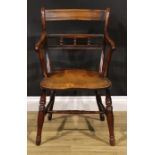 An early 19th century yew and elm elbow chair, saddle seat, turned legs, H-stretcher, 86cm high,