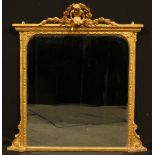 A late 19th century giltwood and gesso chimney glass, bevelled mirror plate, the frame crested by