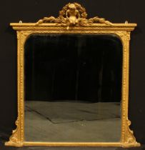A late 19th century giltwood and gesso chimney glass, bevelled mirror plate, the frame crested by