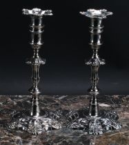 A pair of George II cast silver table candlesticks, unusually tall detachable nozzles, knopped