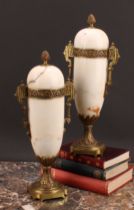 A pair of French gilt metal mounted marble mantel urns, 33cm high, first-half 20th century