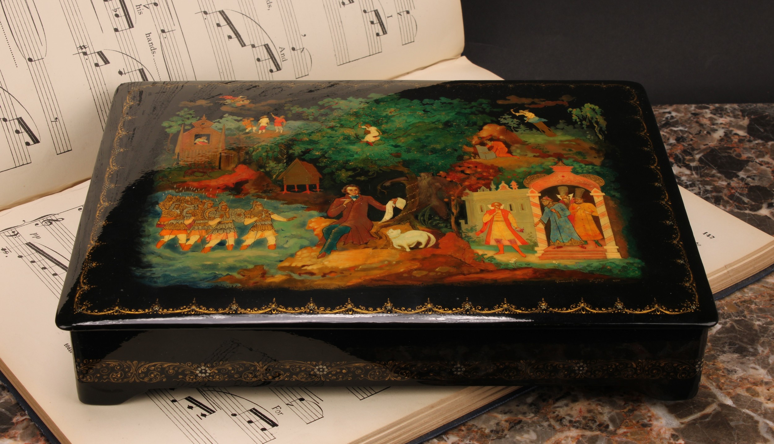 A Russian lacquer rectangular box, the hinged cover painted in polychrome with a narrative scene,