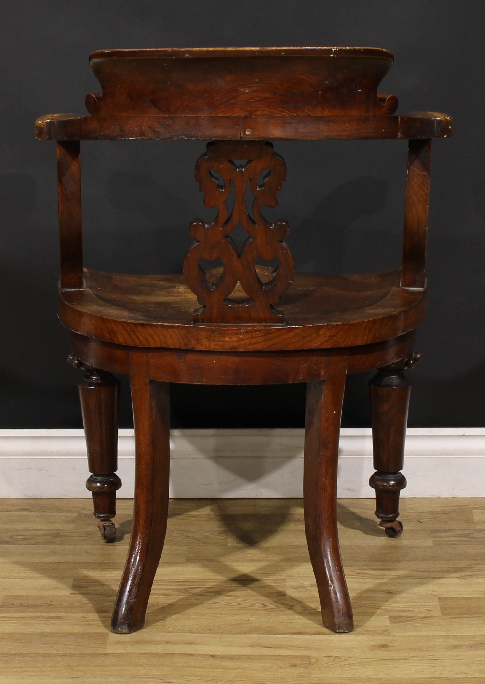 A Victorian oak desk chair, by Thomas Simpson & Sons, Halifax, Yorkshire (fl.1876-1954), badged, - Image 4 of 4