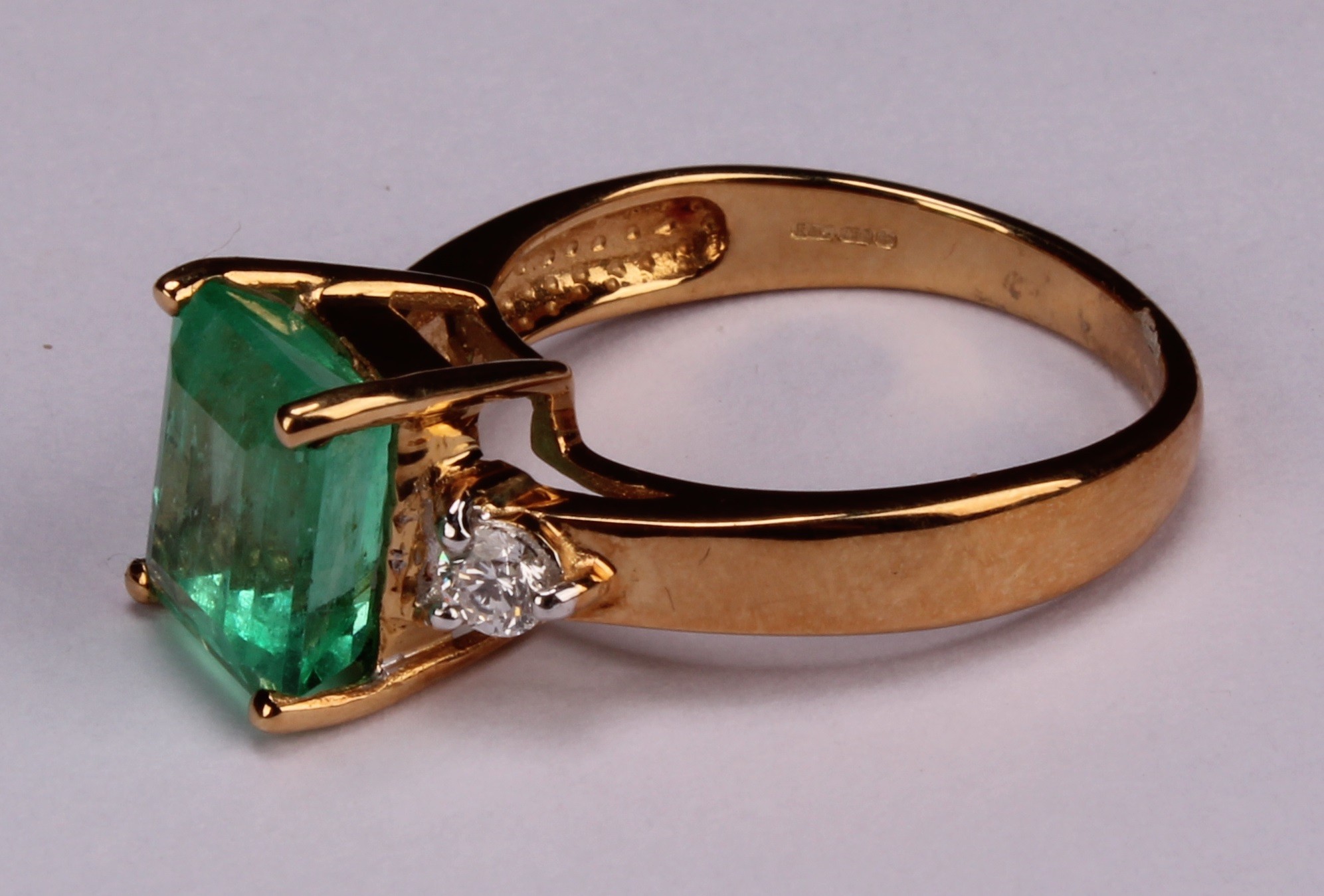 An 18ct gold, emerald and diamond ring, central cushion cut stone - Image 3 of 4
