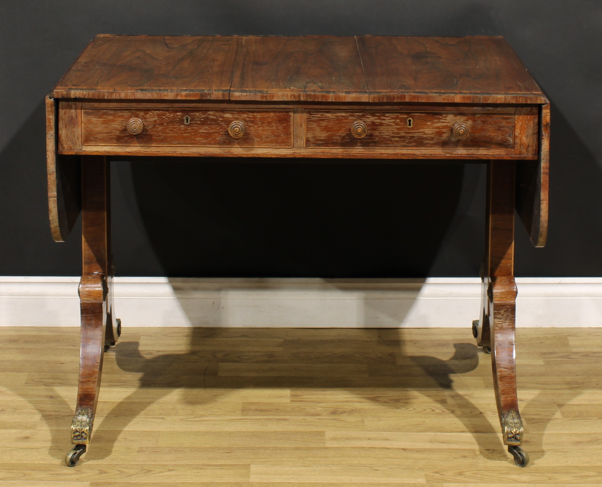 A Regency rosewood sofa table, crossbanded rounded rectangular top with fall leaves, above a pair of - Image 2 of 7