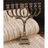 Judaica - an Israeli Jewish silver menorah, stepped square base, scroll feet, 30.5cm high, Hadad,