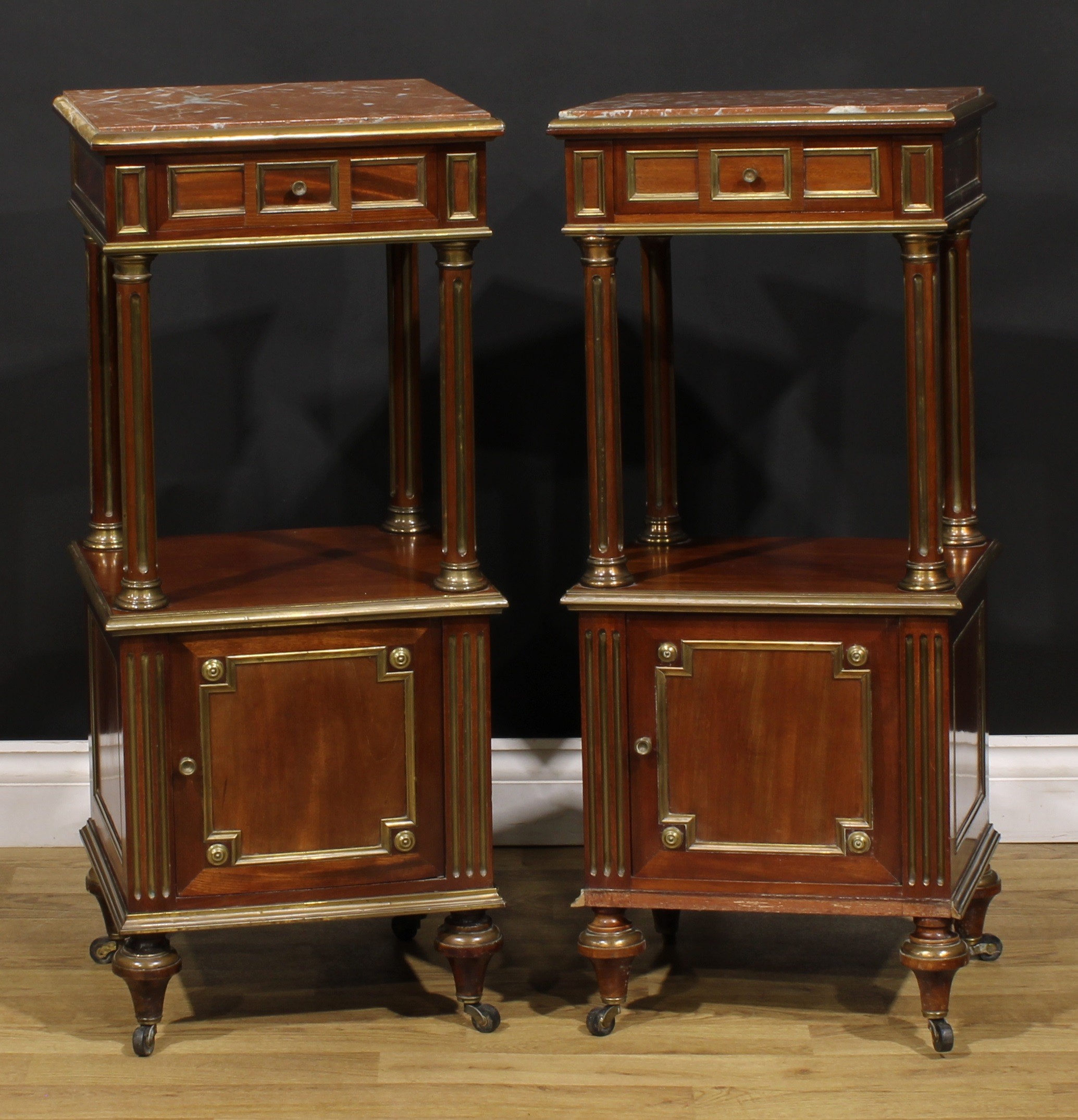 A pair of French Empire design Third Republic period brass mounted and parcel-gilt mahogany tables