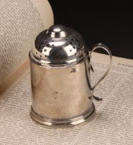 A George II silver kitchen pepper, domed pierced cover, scroll handle, skirted base, 8.5cm high,