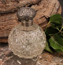 A Victorian silver mounted hobnail-cut globular scent bottle, hinged cover chased in the Rococo