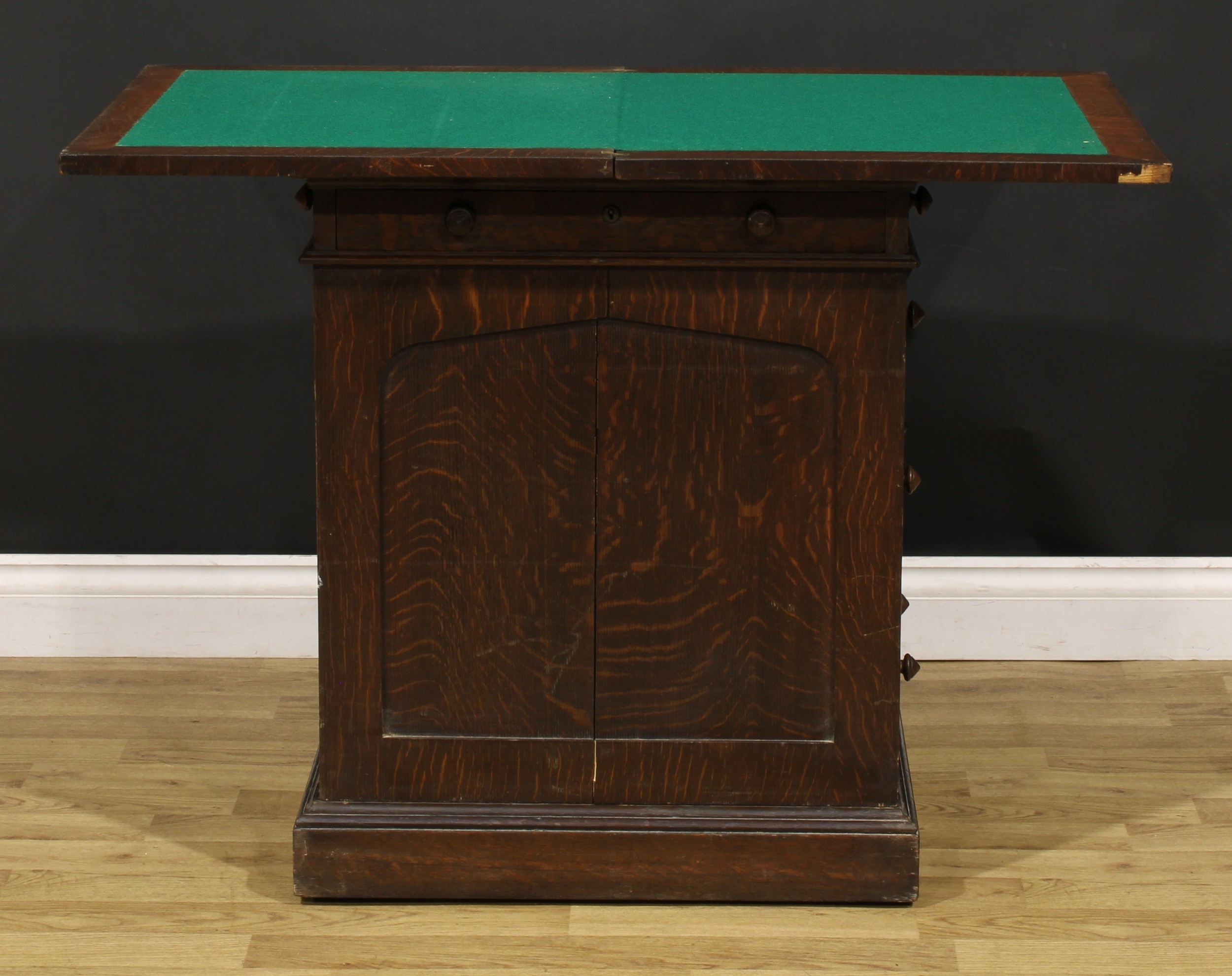 A late 19th century oak single pedestal desk, hinged top enclosing a baize surface above a long - Image 3 of 6