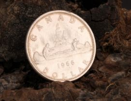 Coins - an Elizabeth II silver Canadian dollar, small beads, 1966