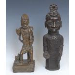 Tribal Art and the Eclectic Interior - a Nigerian bronze Benin bust, of a male warrior, half