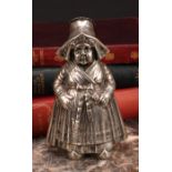 A large German silver novelty pepper, as a young Dutch girl traditionally dressed, 13cm high,