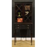 A Chippendale Revival mahogany and blind fretwork library bookcase, moulded cornice above a pair
