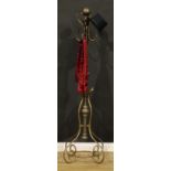 An early 20th century brass coat and hat stand, possibly American, sphere finial above four