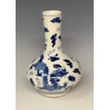 A Chinese export ware compressed ovoid bottle vase, decorated in underglaze blue with dragons and