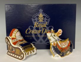 A pair of Royal Crown Derby paperweights, Father Christmas in Sleigh and Reindeer, gold stoppers,