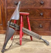 A Victorian stool, 56cm high; a yoke; a cobblers last (3)