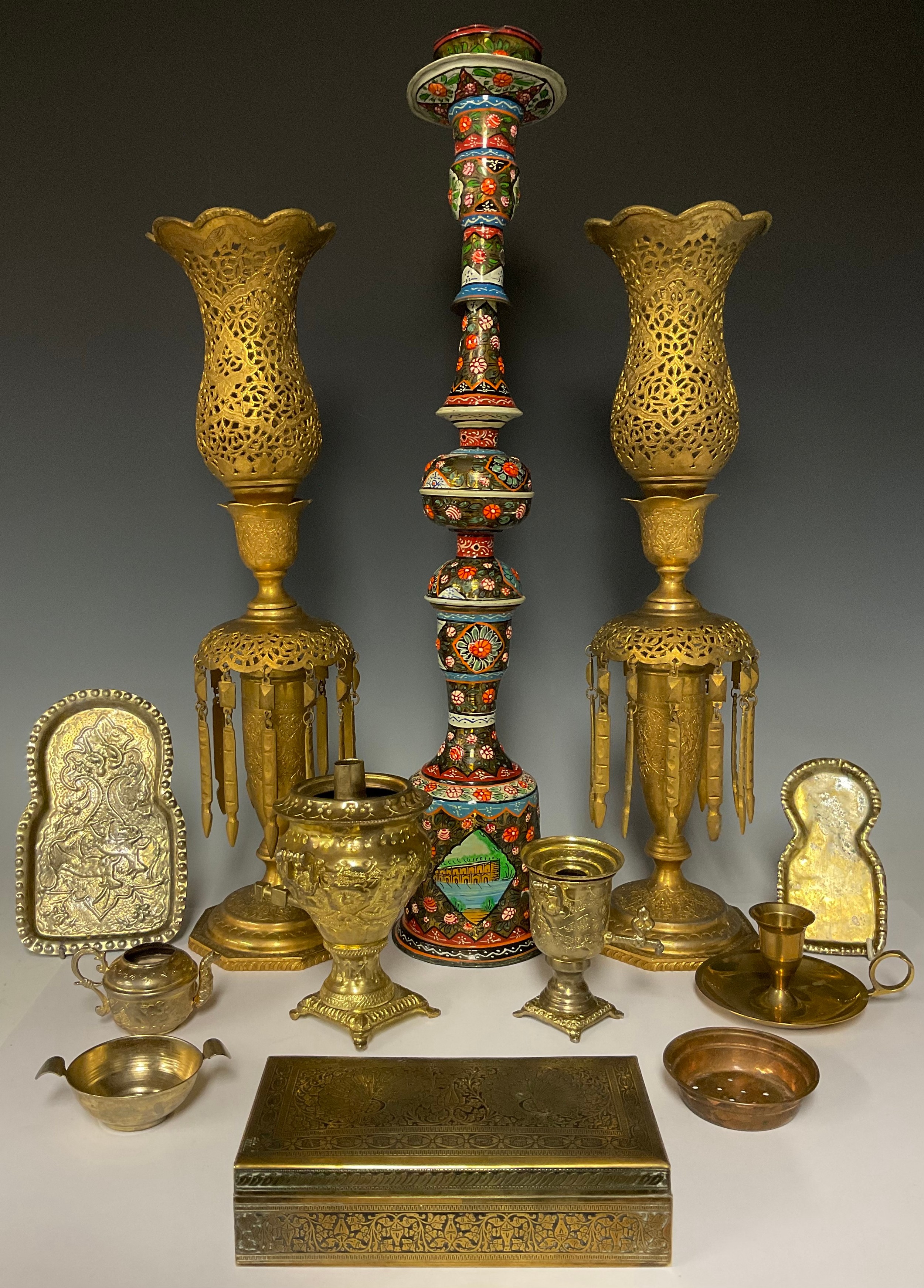 A pair of pierced gilt metal lustre type candlesticks with droplets, 47.5cm; a Middle eastern