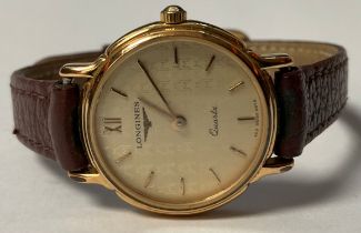 A lady's Longines gold plated stainless steel watch, Champagne dial, Roman and baton indicators,