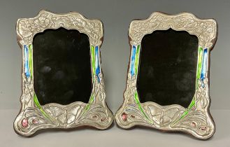 A pair of Art Nouveau style enamelled silver photograph frames, stamped sterling, 21cm high, 15cm