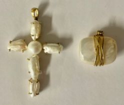 A 9k gold mounted mother-of-pearl cross pendant, marked 9k, 8g gross; a 9k gold mounted mother-of-