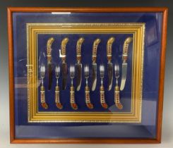 A set of six Royal Crown Derby Imari 1128 pattern pastry knives and forks, framed and mounted in a