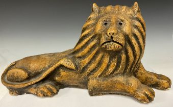 A composite stone model, of a recumbent lion, in the Brampton taste, 58cm wide