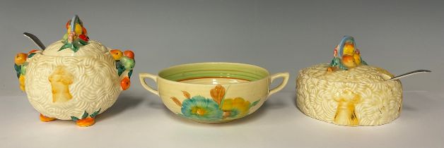 Two Harvest ware Clarice Cliff jam pots, Celtic Harvest pattern, each with an EPNS spoon; a