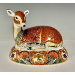 A Royal Crown Derby paperweight, Resting Doe, Collector's guild exclusive, gold stopper, 16cm