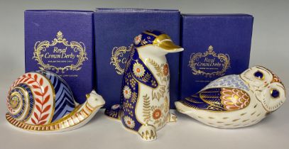 A Royal Crown Derby paperweight, Duckbilled Platypus, gold stopper, 12cm, printed mark in red,