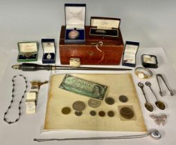 A Canada dollar, 1897, other Canadian coins and a bank note; a 19th century sharpening steel; a