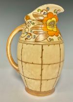 Ceramics - a Bursley Ware Charlotte Rhead Arabesque pattern jug, 24cm high