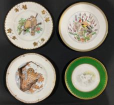 A hand painted plate, decorated by J McLaughlin, signed, the central field with a swan and