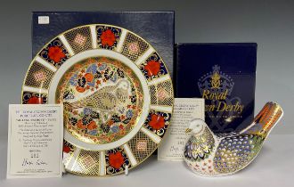 A Royal Crown Derby paperweight, Millennium Dove, gold stopper 15cm long, also a Millennium Dove