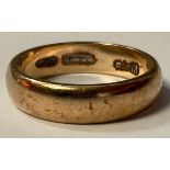 A gold wedding band, size O, marks obscured, probably 18ct, 4.5g